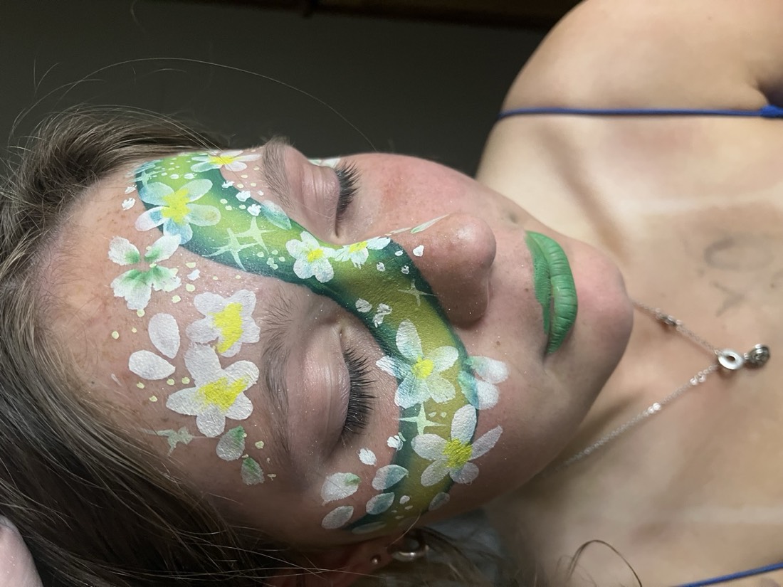 Green floral vine face paint design